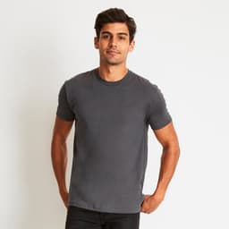 A men's grey cotton crew t-shirt is worn by a model, featuring a classic crew neck and short sleeves.