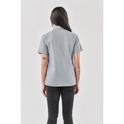 A women's button-up shirt in light grey, featuring short sleeves and a subtle logo on the back.