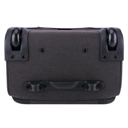 A wheeled underseat luggage in dark grey fabric with black accents and sturdy wheels.