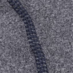A close-up of a grey fabric featuring a navy seam detail, showcasing a textured design. The item has a branding logo.
