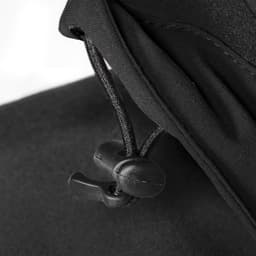 A close-up of a black jacket featuring a toggle adjustment on the collar. It has a sleek, textured fabric.