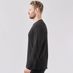 A men's crew neck shirt in dark grey, featuring long sleeves and a fitted silhouette. It has a logo on the front.