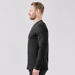 A side view of a men's long-sleeve Henley shirt in black, featuring a collar and a logo.