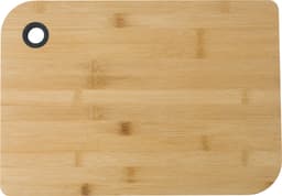 A bamboo cutting board featuring a rounded corner and a hole for hanging, showcasing a natural wood finish.