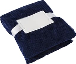 A dark navy blue flannel fleece blanket with a decorative band and a tag. It features a soft, textured surface.