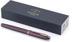 A bronze Parker IM Monochrome PVD rollerball pen alongside a sleek black packaging box with branding.
