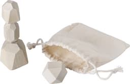 A wooden skill game with three geometric pieces in natural wood finish and a cream drawstring bag.