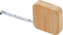 A bamboo tape measure with a smooth, square design and a white measuring tape marked in black.