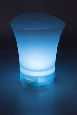 An ABS ice bucket in a curved design, featuring a glowing blue light at the base and a provided speaker.