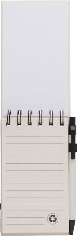 A recycled milk carton notebook in light colour with a spiral binding and a black pen attached.