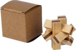 A wooden patience game featuring a star-like puzzle next to a brown cardboard box.