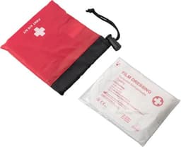A red and black first aid kit with a film dressing packet beside it, featuring a logo.