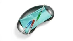 A stainless steel tray holds three colourful pens: red, blue, and green, alongside a teal cloth.
