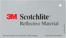 A tag featuring grey reflective material with a prominent red logo and brand name, displaying information about the product.