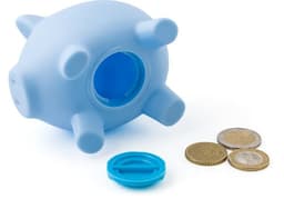 A blue PVC piggy bank with a removable base, placed next to a few coins. It features a simple design.