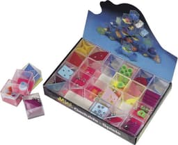 A colourful game box containing various translucent geometric shapes and components, arranged in a compartmentalised layout.