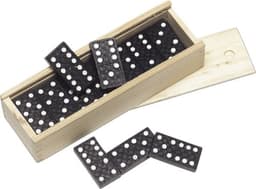 A wooden box containing black dominoes with white dots, some pieces scattered outside the box.