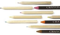 A collection of wooden crayons in various colours, some with black branding and others in natural wood.