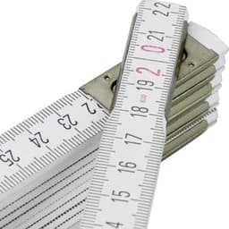 A wooden foldable ruler in white and silver, showing measurement markings up to 25.