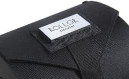 A black Rollor® travel tie carrier featuring a textured surface and a branding label.