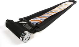 A black and silver tie carrier containing an orange and blue striped tie, with a branded handle.