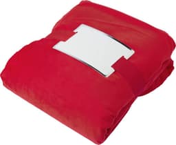 A red polyester blanket, neatly folded and secured with a white strap, featuring a logo.
