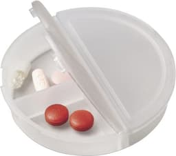 A white, circular pill box with compartments, containing various coloured tablets, including red and pink options.