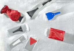 An assortment of ice scrapers and a snow brush in red and blue, set against a snowy background.