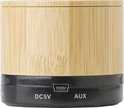 A bamboo wireless speaker with a black base and ports for charging and AUX connection.