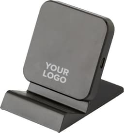 A sleek black plastic wireless charger with a stand design, featuring a logo on the front.