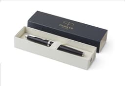 A black Parker IM rollerball pen inside a cream and blue box with a logo on the lid.