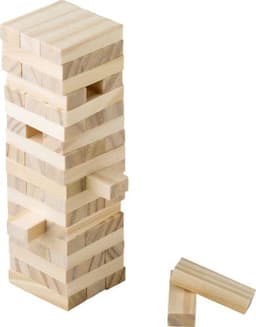 A wooden skills game featuring a tower of light wooden blocks with some pieces lying beside it.