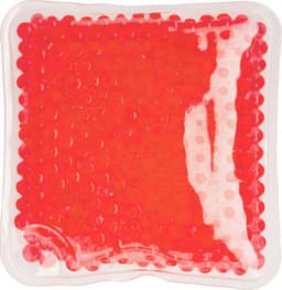A red PVC hot/cold pack with textured surface in a clear gel casing, featuring a logo on the corner.
