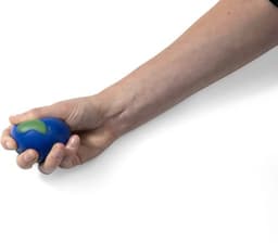 A hand gripping a blue PU foam globe with a green continent design, suitable for stress relief.