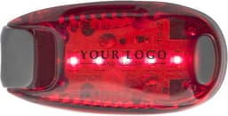 A red ABS safety light with a logo and two illuminated lights, featuring a smooth, rounded design.