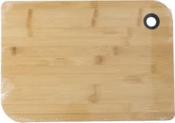 A bamboo cutting board with a rounded corner and hanging hole, featuring a natural light brown colour.