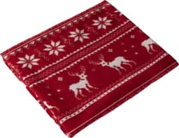 A red polar fleece blanket featuring white reindeer and snowflake patterns, folded neatly.