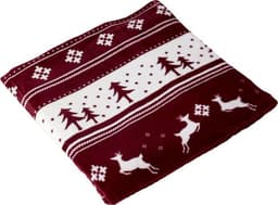 A burgundy and white polyester blanket featuring a winter-themed pattern with trees and reindeer. It has a logo.