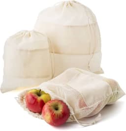 A set of three reusable cotton mesh produce bags in natural colour, with apples inside one bag.