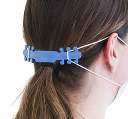 A blue ear saver is worn at the back of a person's head, securing mask straps away from the ears.