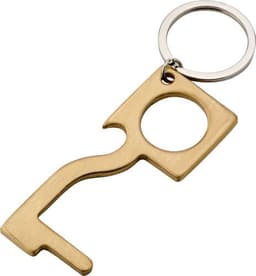 A copper door opener on a keyring, featuring a unique shape with a circular cutout.