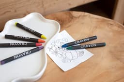 Cardboard box with crayons
