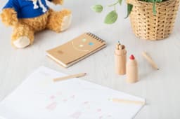 Wooden tube with pencils
