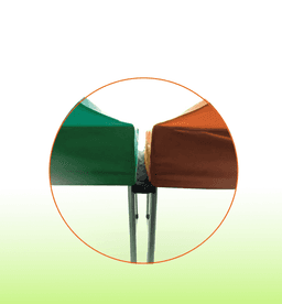 A close-up of a gazebo marquee gutter kit, featuring green and orange canopies joined at the edges.