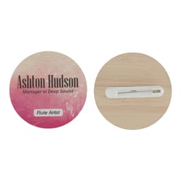 A round bamboo tag measuring 50mm, featuring a pin on one side and a gradient pink design on the other.