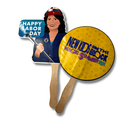 Two custom hand fans: one is round and yellow with a logo, the other features a woman in a red hat holding a sign.