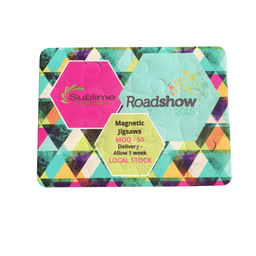 A magnetic jigsaw puzzle with 12 pieces featuring vibrant geometric patterns in pink, green, and blue.