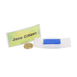 A clear name tag holder with a blue reverse magnet and a gold coin for scale. Features a logo on the holder.