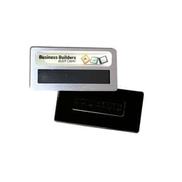 A silver DIY staff badge featuring an epoxy label magnet with a black backing. Includes a logo or branding.