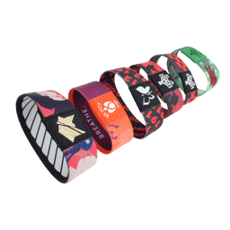 A collection of multicoloured elastic wristbands, featuring various designs and a small logo on each band.